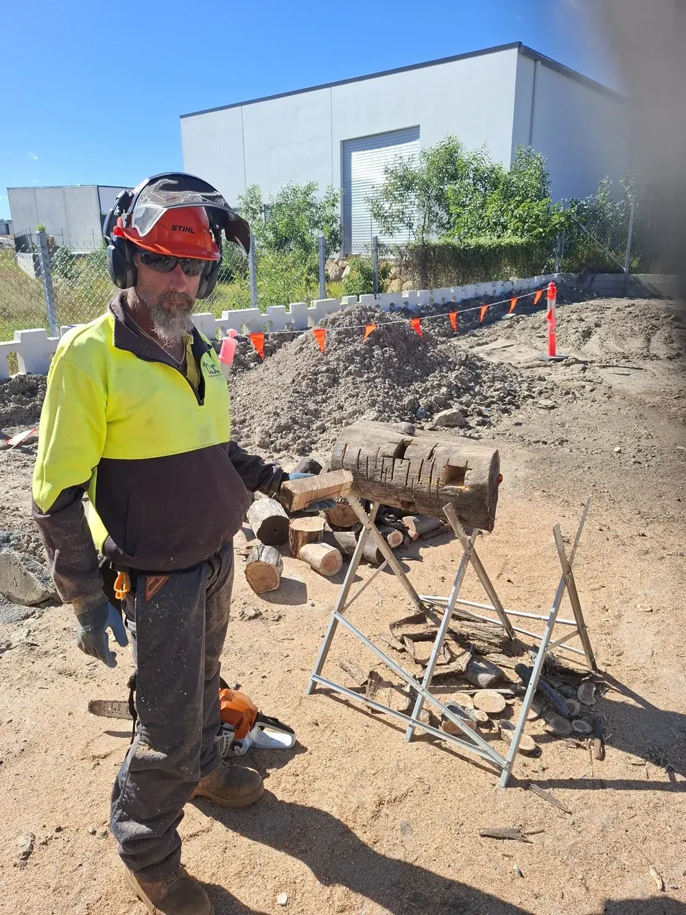 Landscape Skills chainsaw trainer wearing full PPE at the Logan Village workshop